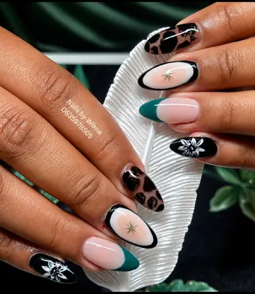 Neutral nails with black animal-print accents
