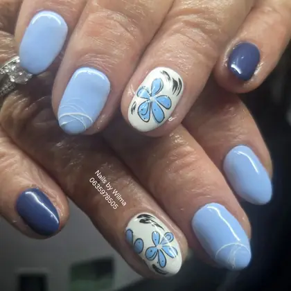 Blue nails with floral accent art