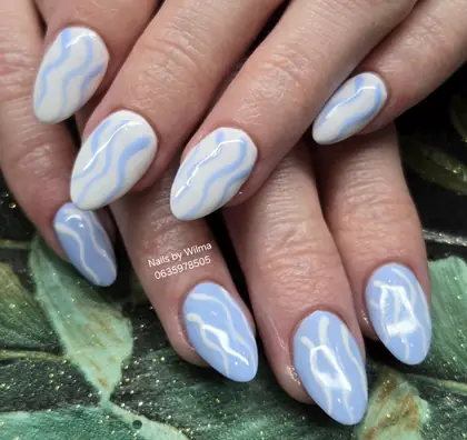 Light blue nails with white swirl details