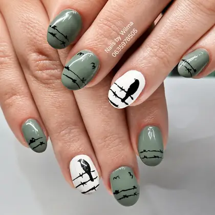 Green nails with black line-art details