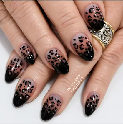 Neutral nails with dark animal-print details