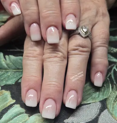 Pale pink nails with white tip details