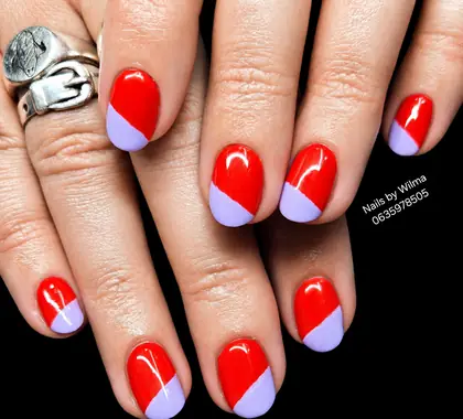 Red nails with purple and white accents
