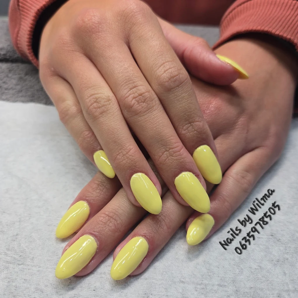 Close-up of pink marble nail art on almond nails