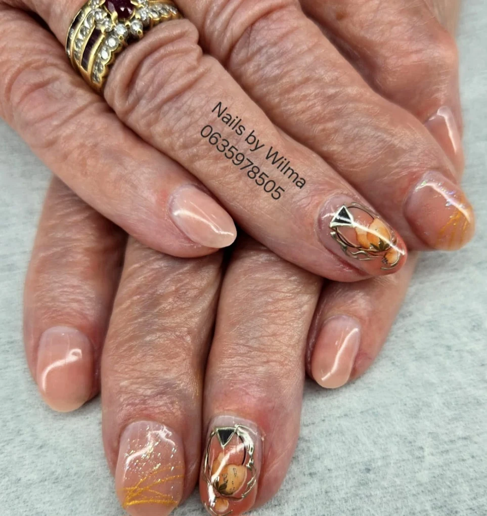 Purple and white floral design on a long nail