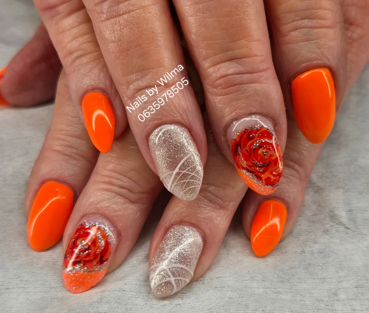 Colorful, abstract flower design on long coffin nails